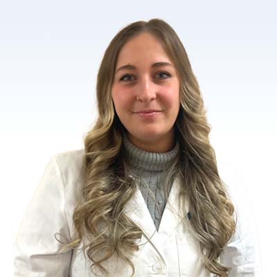 margo rennick, hearing care professional wearing a white coat