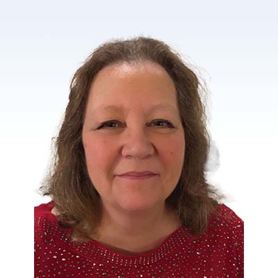 michelle lee, hearing care specialist, wearing a red sweater with a sparkling design