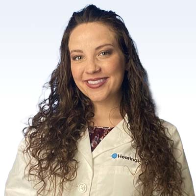 rebecca arias castro hearing care specialist in white lab coat