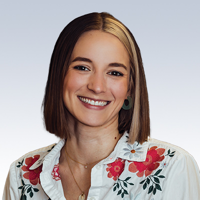 rebecca krouse hearing care specialist wearing a floral embroidered blouse