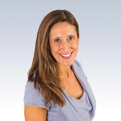 Rebecca Ratliff wearing a light blue top with a neutral gradient background.