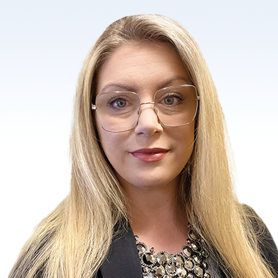 Rebecca Rexroat, hearing care professional with long blonde hair and a black blazer.