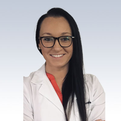 hearing care specialist in a white coat