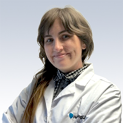 Stephanie Dymek, hearing care professional wearing a white HingLu lab coat.