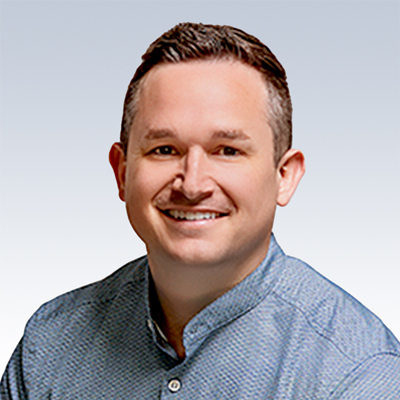 Steven Kulsar, hearing care specialist wearing a light blue textured shirt.