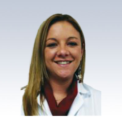 Teresa Perry, hearing care specialist wearing a white coat.