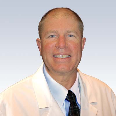 Vincent Rapini, hearing care specialist in professional attire.