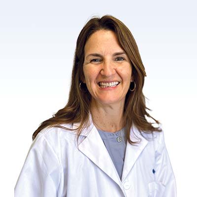 Annmarie Reebenacker, hearing care professional wearing a white lab coat.