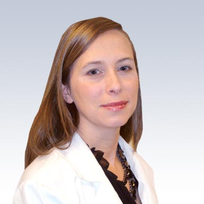 Bobbie McCue wearing a white lab coat against a gradient background.