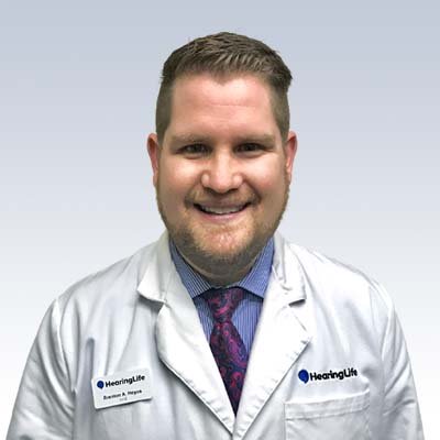 Brenton A. Hoyos in a HearingLife lab coat with a professional appearance.