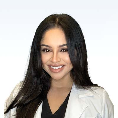 brianna rangel, hearing care professional wearing a white coat