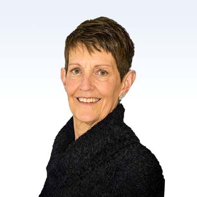 Jane Heath, hearing care specialist with short brown hair, wearing a black sweater.