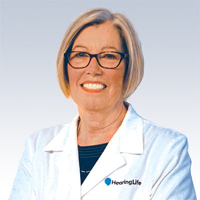 Hearing care specialist wearing a HearingLife lab coat