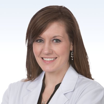 hearing care professional wearing a white lab coat