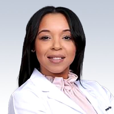 olivia roberts, hearing care specialist wearing a white coat