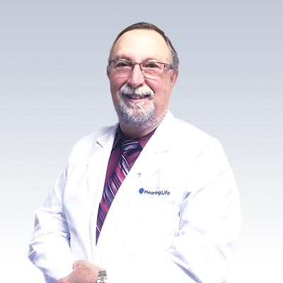 Reagan Beam wearing a HearingLife lab coat.