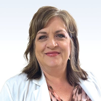 Regina Fromholt, hearing care professional wearing a white coat against a light background
