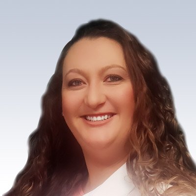 Sarah Thomas, hearing care professional with curly brown hair, wearing a white coat.