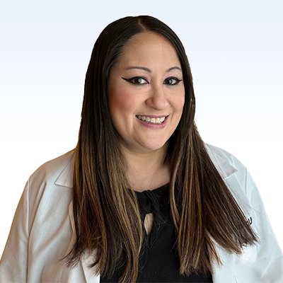 Simone Hennings, hearing care professional wearing a white coat.