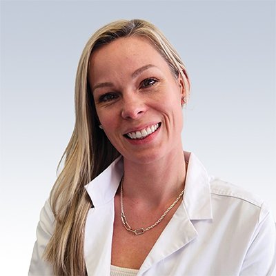 Hearing care professional in a white lab coat.