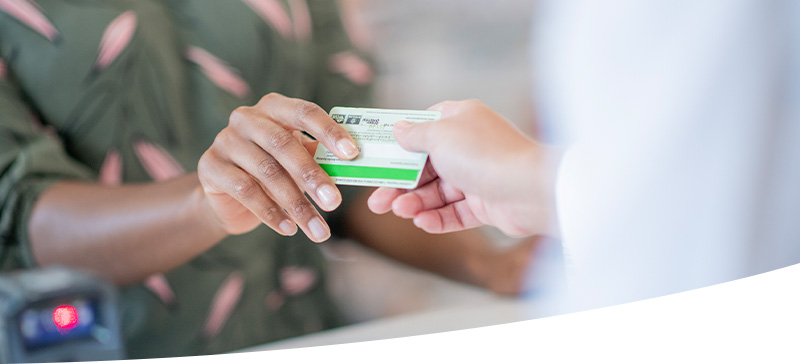 person using fsa/hsa insurance card