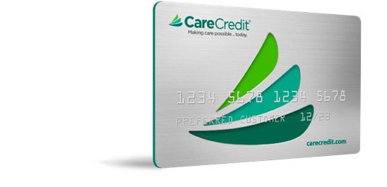 A credit card with green and blue leaf-like logos, displaying: 