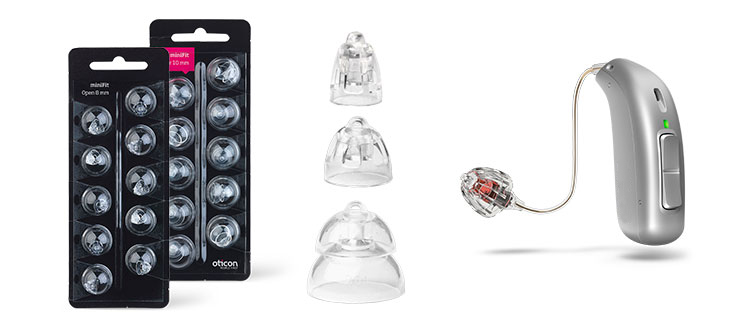 The image displays a silver hearing aid device alongside detachable clear domes and Oticon-branded miniFit Open domes packaging. Designed for hearing care, it provides customizable and advanced sound solutions.