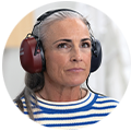 Woman with hearing test headphones on