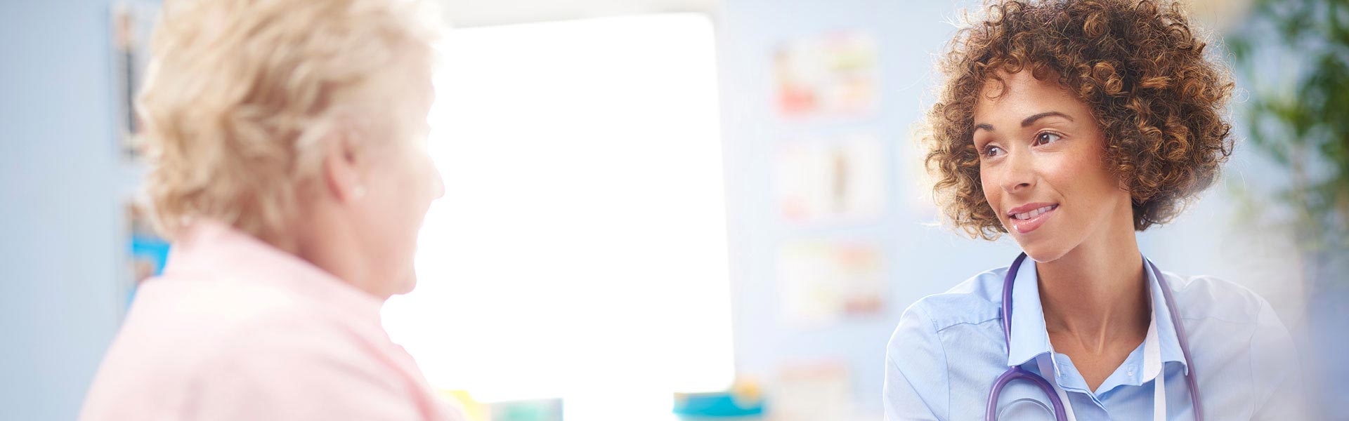 Audiologist consulting a patient in a modern hearing clinic