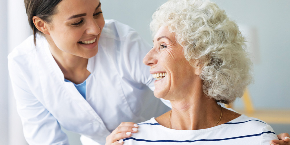 Senior woman smiling at Hearing Care Provider