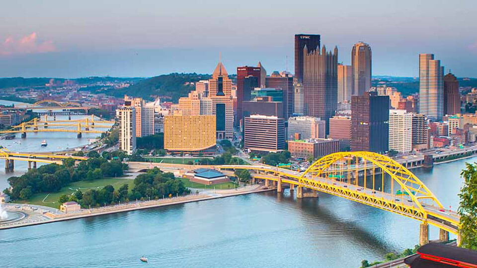Greater Pittsburgh Area skyline featuring rivers, bridges, and urban architecture.
