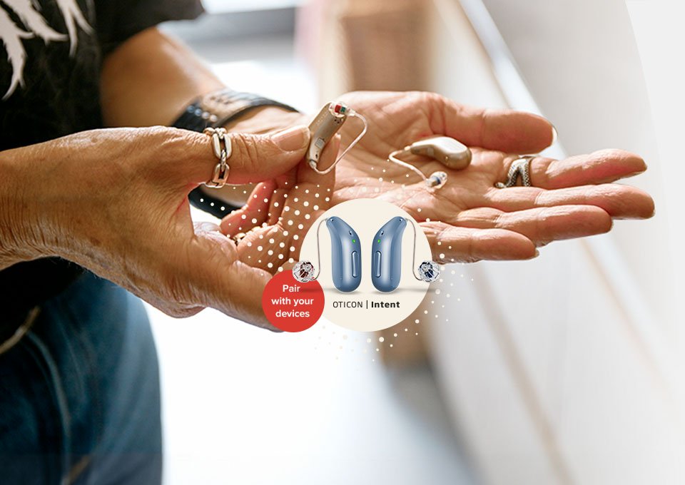 The NEW Oticon Intent™ in Maria's hand