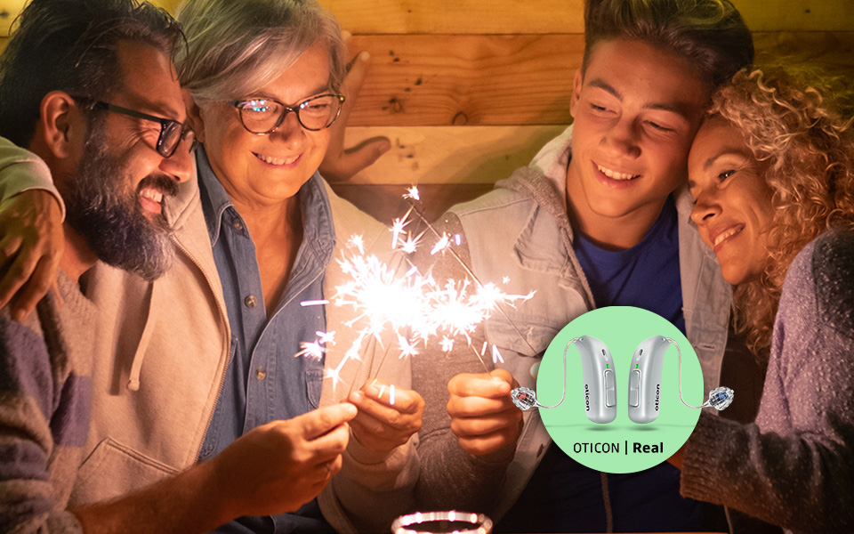 Family enjoying conversation while wearing Oticon Real™ hearing aids