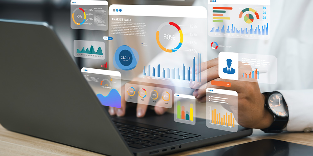 Hearing professional on laptop, various graphs are displayed