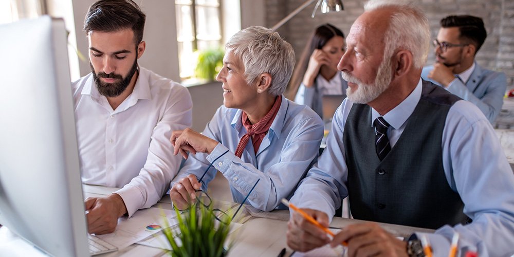 Team collaborating on hearing care strategies with HearingLife.