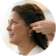 woman being fitted with hearing aaid