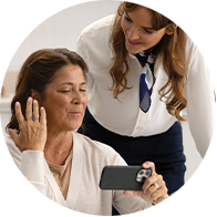 hearing care provider with woman discussing hearing loss