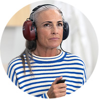Woman wearing hearing test headphones
