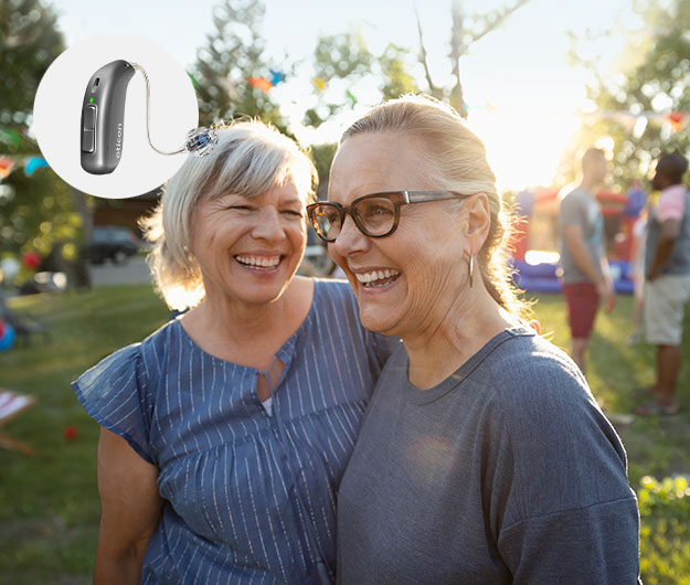 Image shows person wearing Oticon More hearing aids