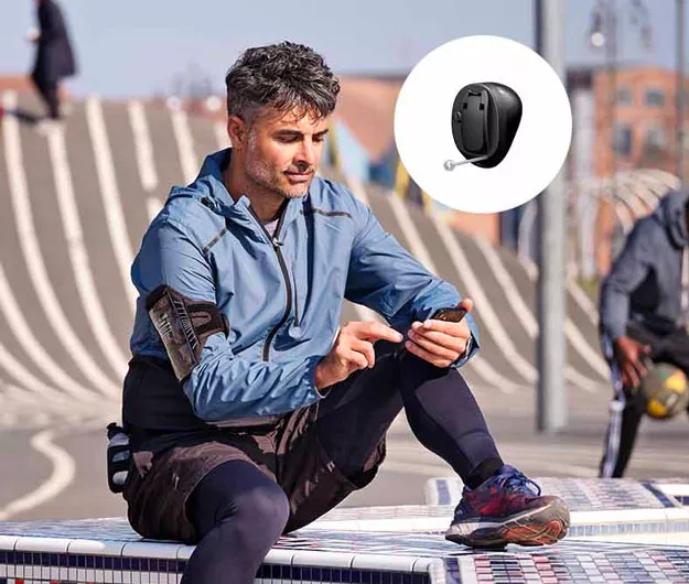 Image shows person wearing Oticon More hearing aids