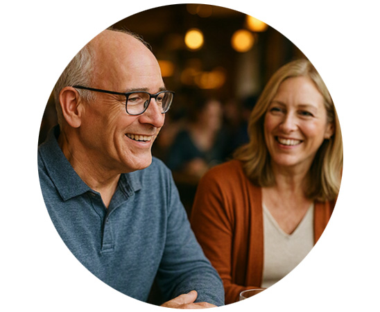 Couple enjoying conversation in a restaurant setting.