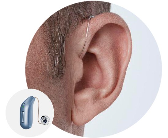 Man wearing a receiver-in-the-ear hearing aid behind his ear.