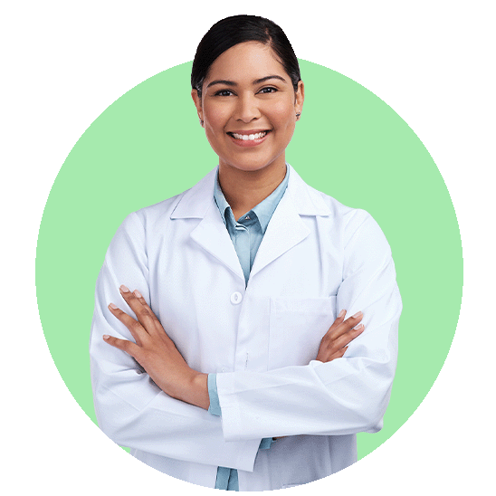 Hearing care specialist wearing a white coat with arms crossed against a green background