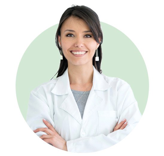 HearingLife audiologist wearing a white coat with arms crossed.