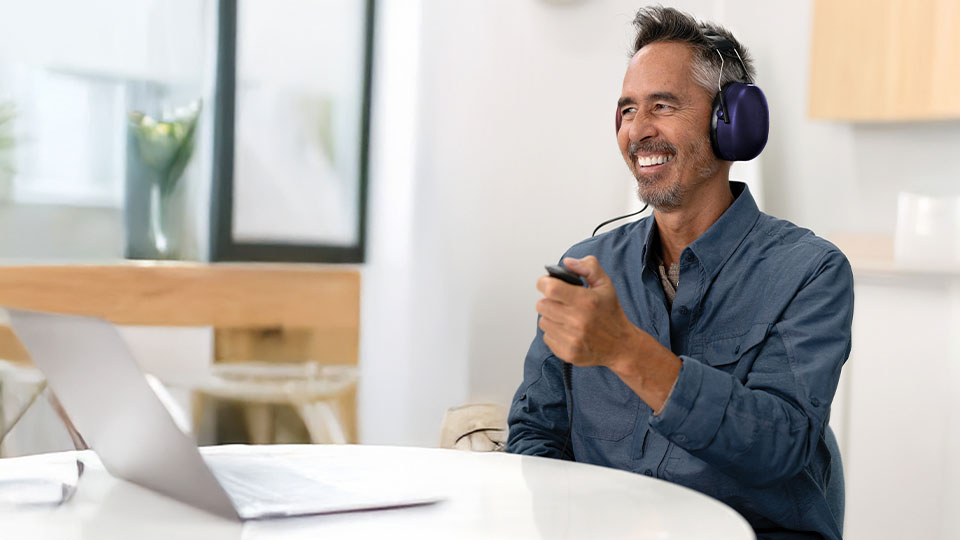 Person smiling during a free hearing test at HearingLife.