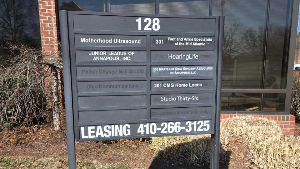 HearingLife location sign in Annapolis displaying various businesses and leasing information.