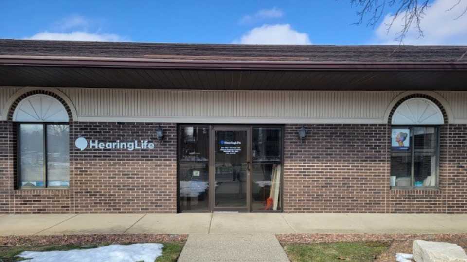 HearingLife Grandville location on Chicago Drive featuring a brick exterior and clear signage.