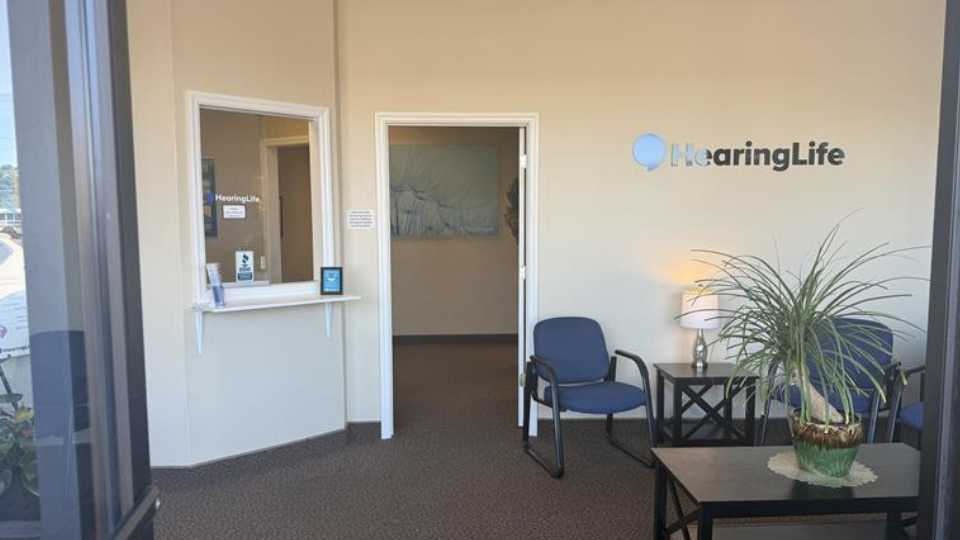 HearingLife Cedar Point lobby featuring a welcoming reception area with seating, signage, and decor.
