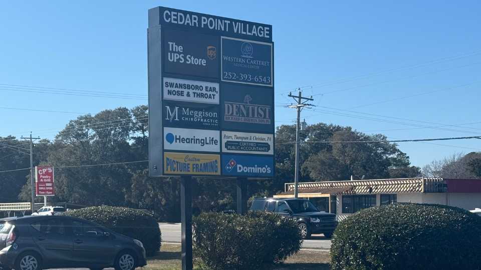 HearingLife location featured on Cedar Point Village sign in North Carolina.