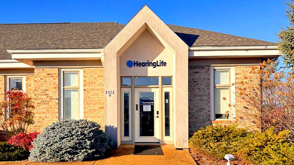 HearingLife hearing care center in Harrisonburg, VA, featuring a brick exterior, clear signage, and surrounding landscaping.